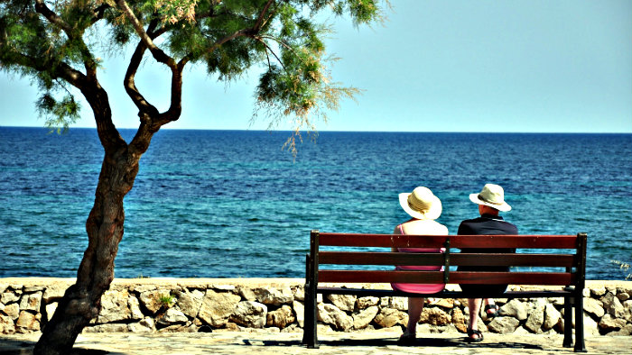 Buy food in the supermarket and eat on a bench with a view.