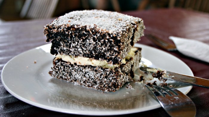 Lamington is made with sponge cake and sprinkled with coconut.