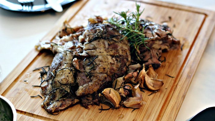 Leg of lamb is prepared with olive oil, rosemary and garlic.