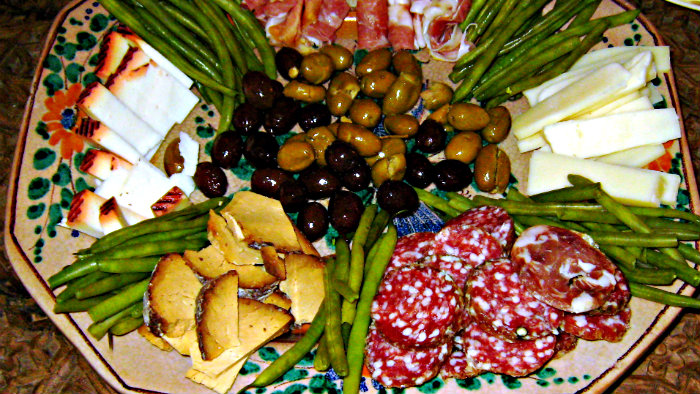 Salami, cheese, olives are popular antipasti ingredients.