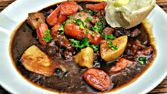 Irish stew is made with lamb, onions, potatoes, carrots.