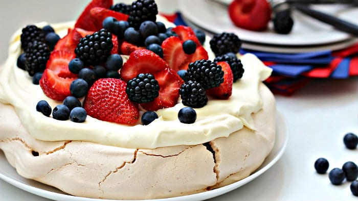 Pavlova is made with meringue, whipped cream and fruit.